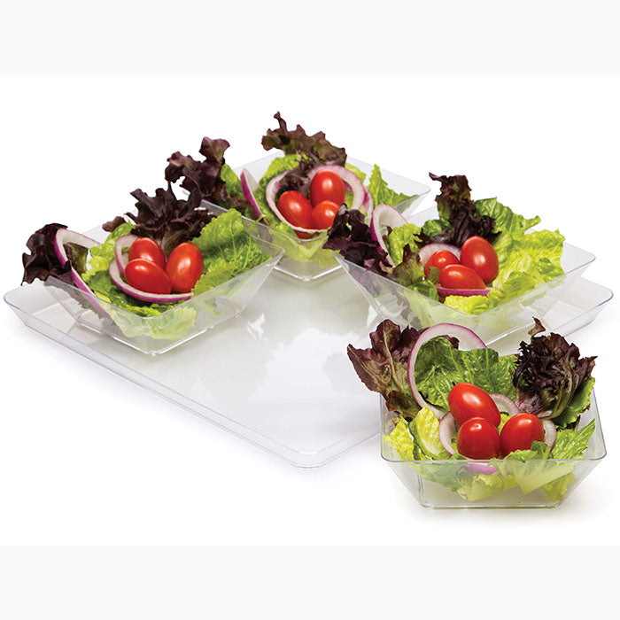 Bowls of salad on a serving tray