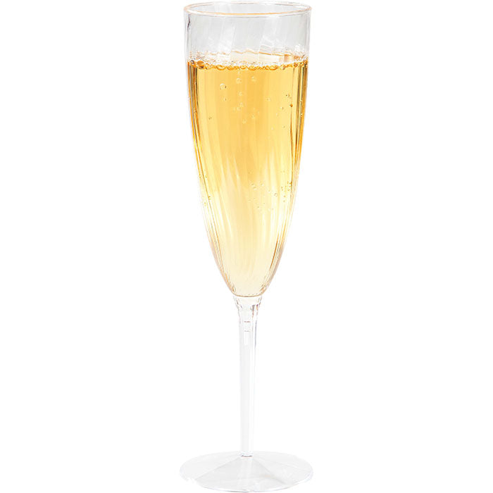 Plastic champagne glass with champagne in it