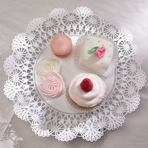 White lace doily with baked treats on top