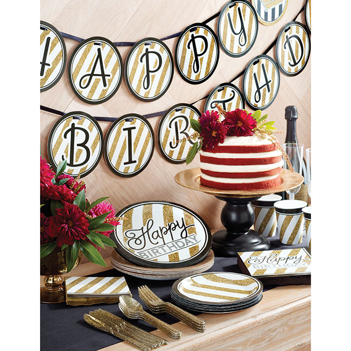 Black and Gold Birthday Party Supplies on a table