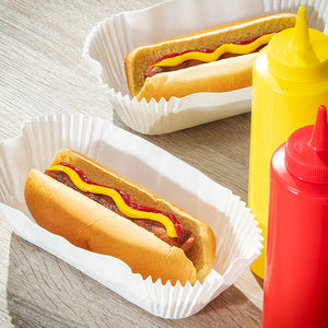 Hot dogs inside of paper fluted food tray