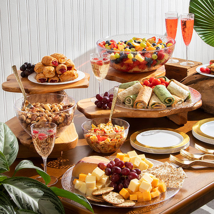 Serving plates, bowls and trays on display with food