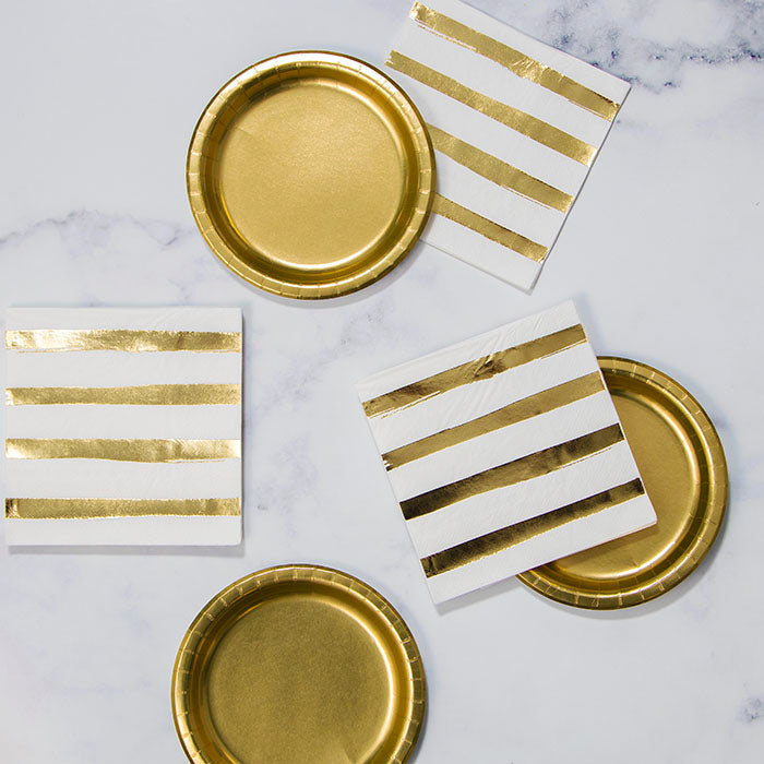 White and Gold Foil Party Supplies on a table