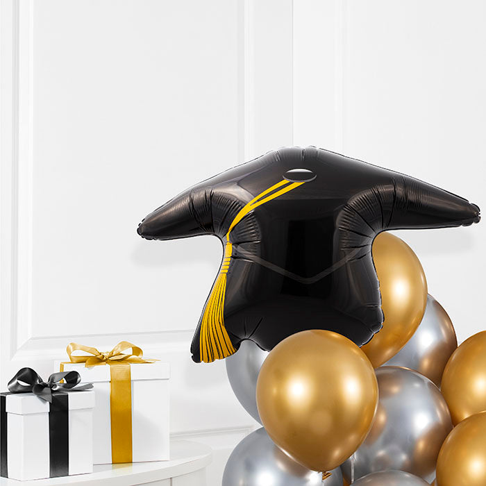 Black Graduation Cap Mylar Balloons 10 ct in a room